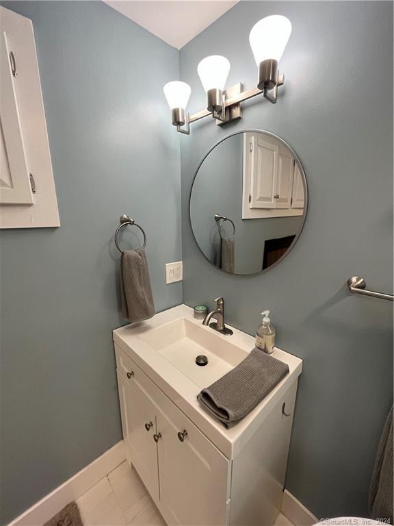 15 Riverview Road New Milford, CT 06755 - Photo 29 of 40 a bathroom with a sink and a mirror