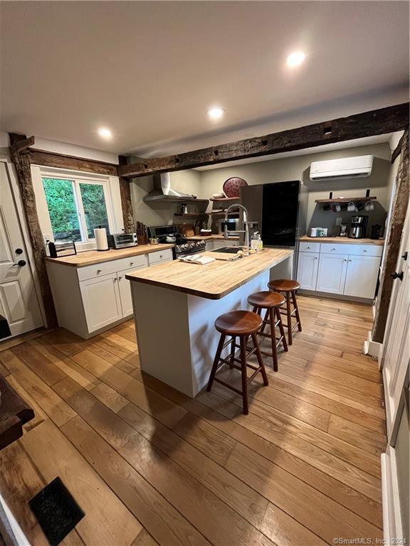 15 Riverview Road New Milford, CT 06755 - Photo 3 of 40 a kitchen with sink cabinets and wooden floor