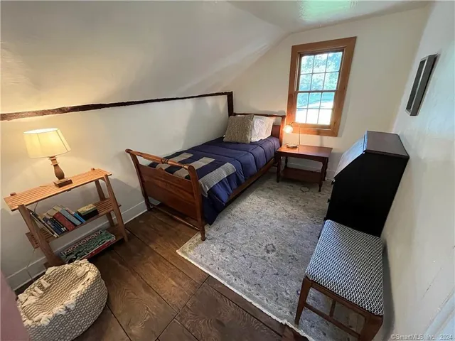 a living room with furniture rug and window