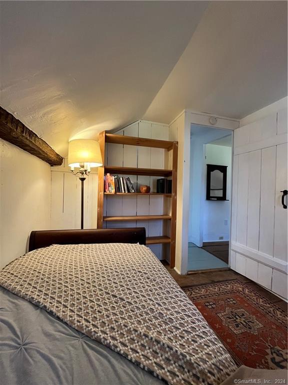 15 Riverview Road New Milford, CT 06755 - Photo 37 of 40 a bedroom with a large bed and a chandelier