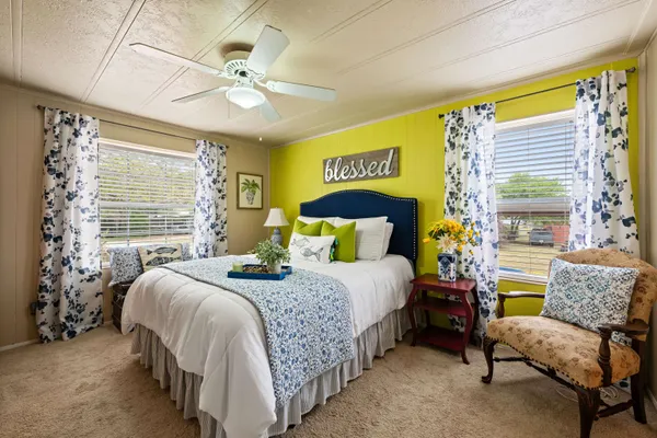 a bedroom with a bed and a couch