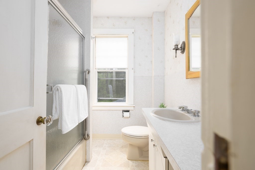 34 Brook Road Sharon, MA 02067 - Photo 11 of 19 a bathroom with a granite countertop sink toilet and shower