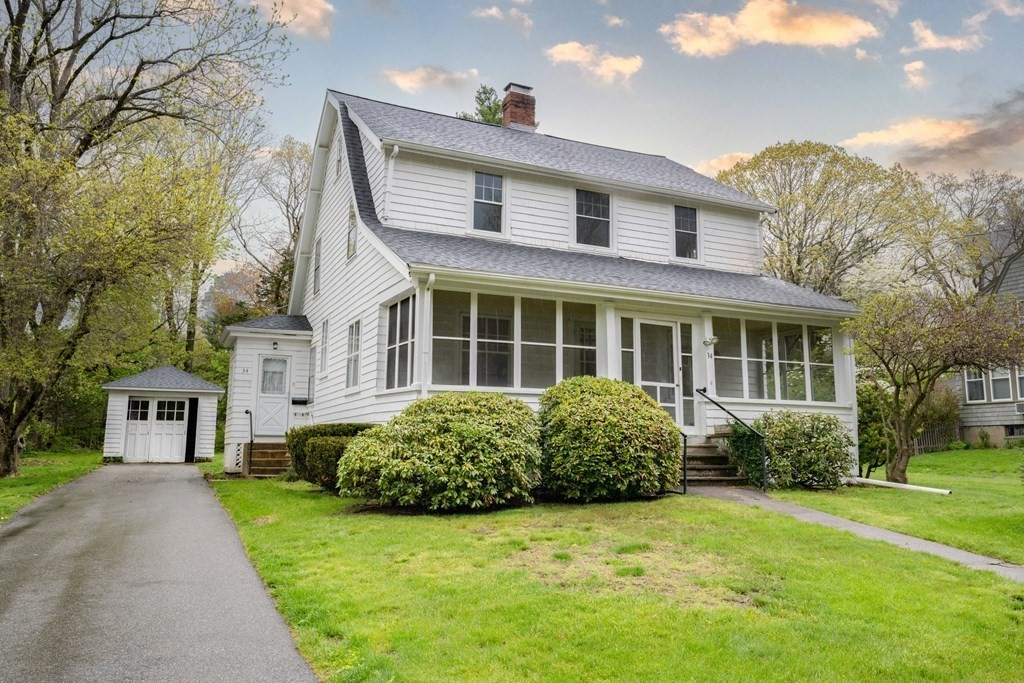 34 Brook Road Sharon, MA 02067 - Photo 2 of 19 a front view of a house with a garden
