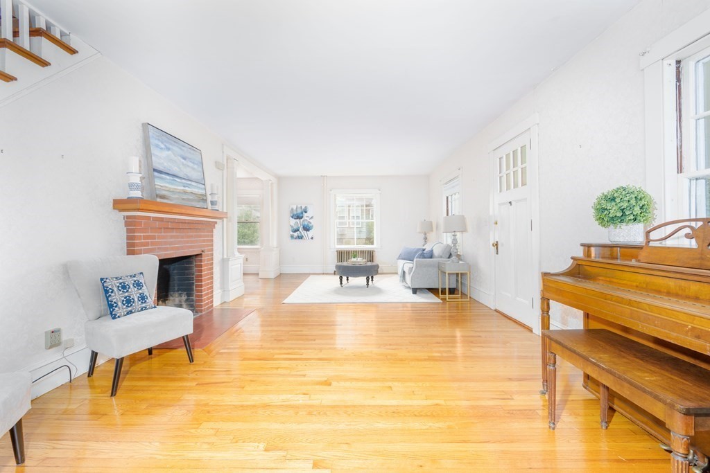 34 Brook Road Sharon, MA 02067 - Photo 5 of 19 a living room with furniture and a fireplace