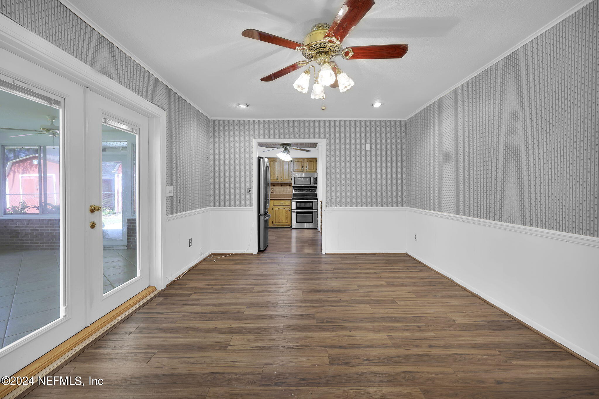 960 Grape Lane St. Johns, FL 32259 - Photo 12 of 46 wooden floor in an empty room with a window