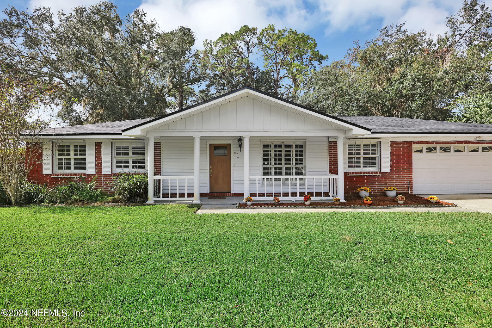 960 Grape Lane St. Johns, FL 32259 - Photo 2 of 46 a front view of a house with a yard and trees