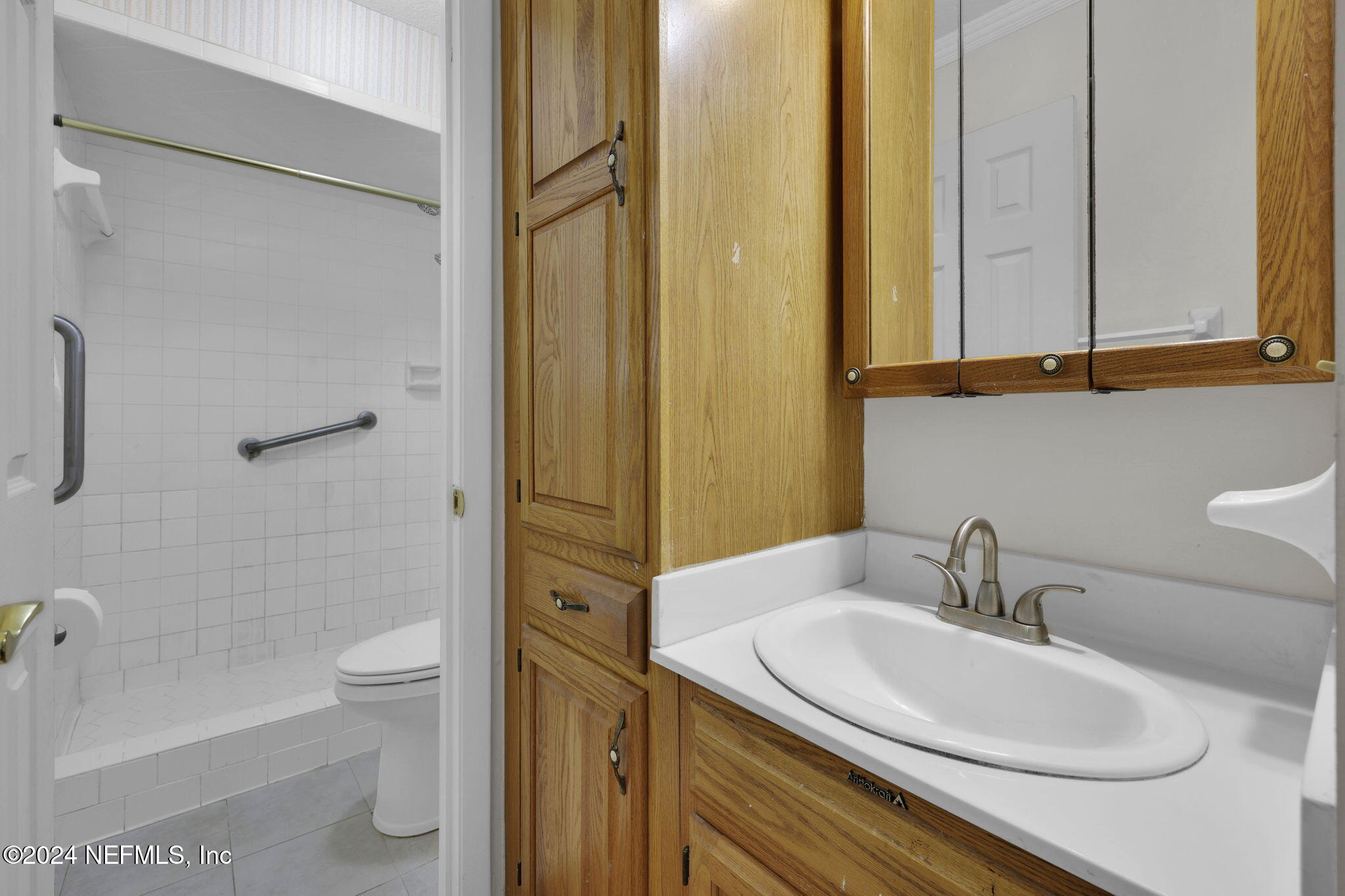 960 Grape Lane St. Johns, FL 32259 - Photo 22 of 46 a bathroom with a sink a toilet and shower