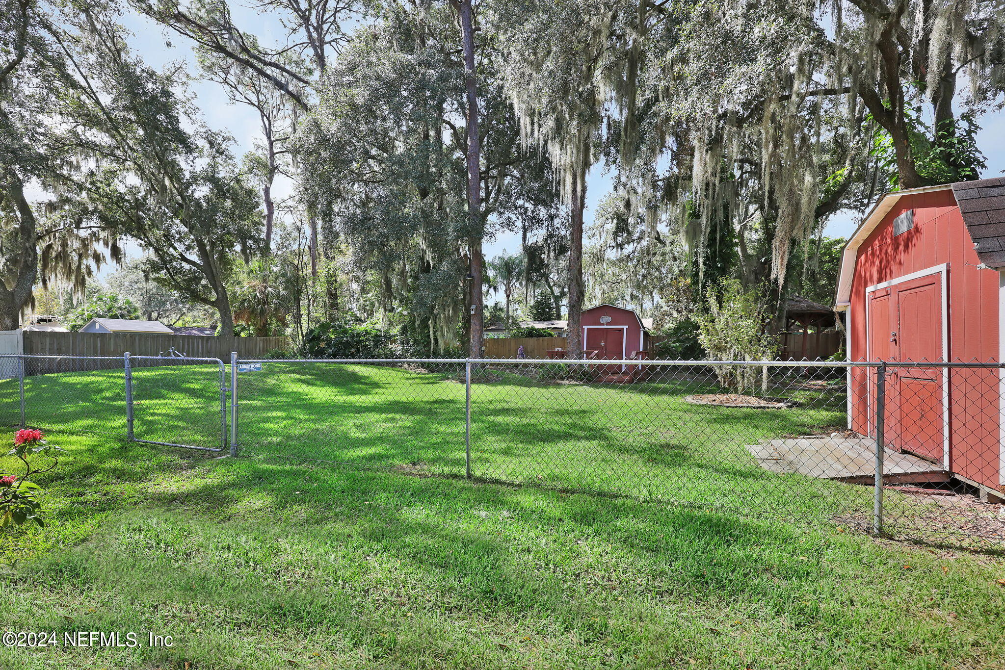 960 Grape Lane St. Johns, FL 32259 - Photo 31 of 46 a view of backyard with trampoline