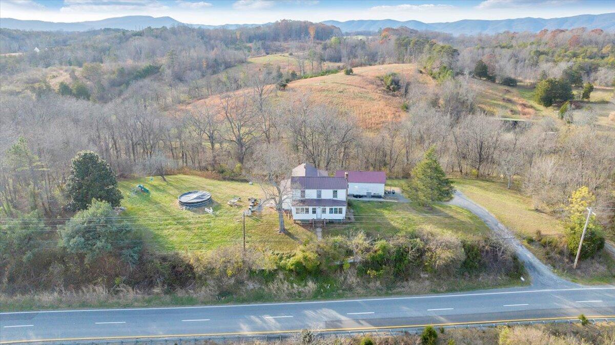 6457 Roanoke Road Fincastle, VA 24090 - Photo 5 of 34 a view of a lake with a mountain
