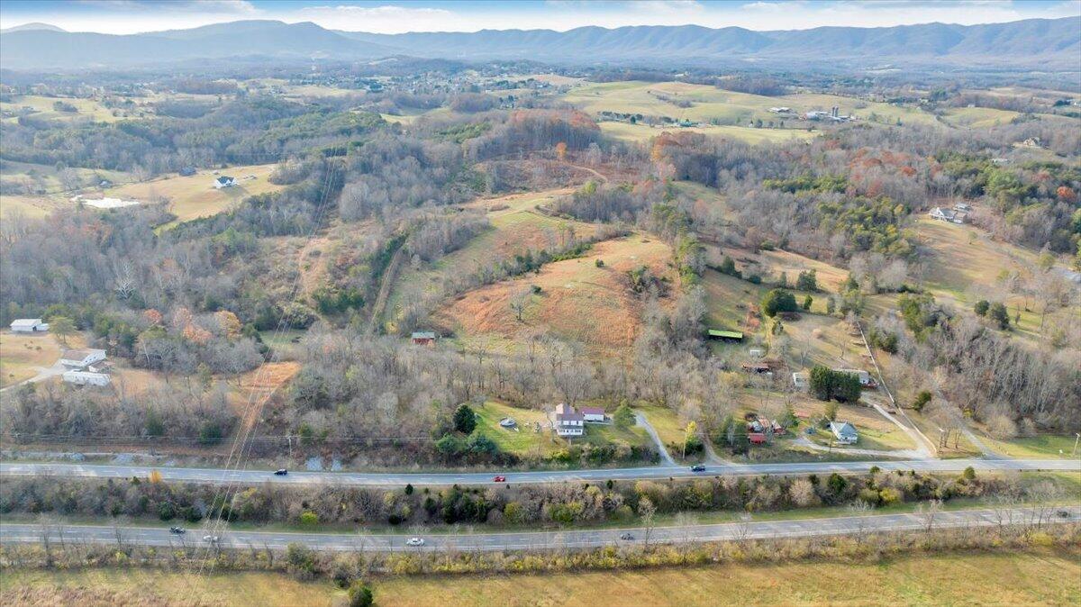 6457 Roanoke Road Fincastle, VA 24090 - Photo 8 of 34 an aerial view of residential building with outdoor space and lake view