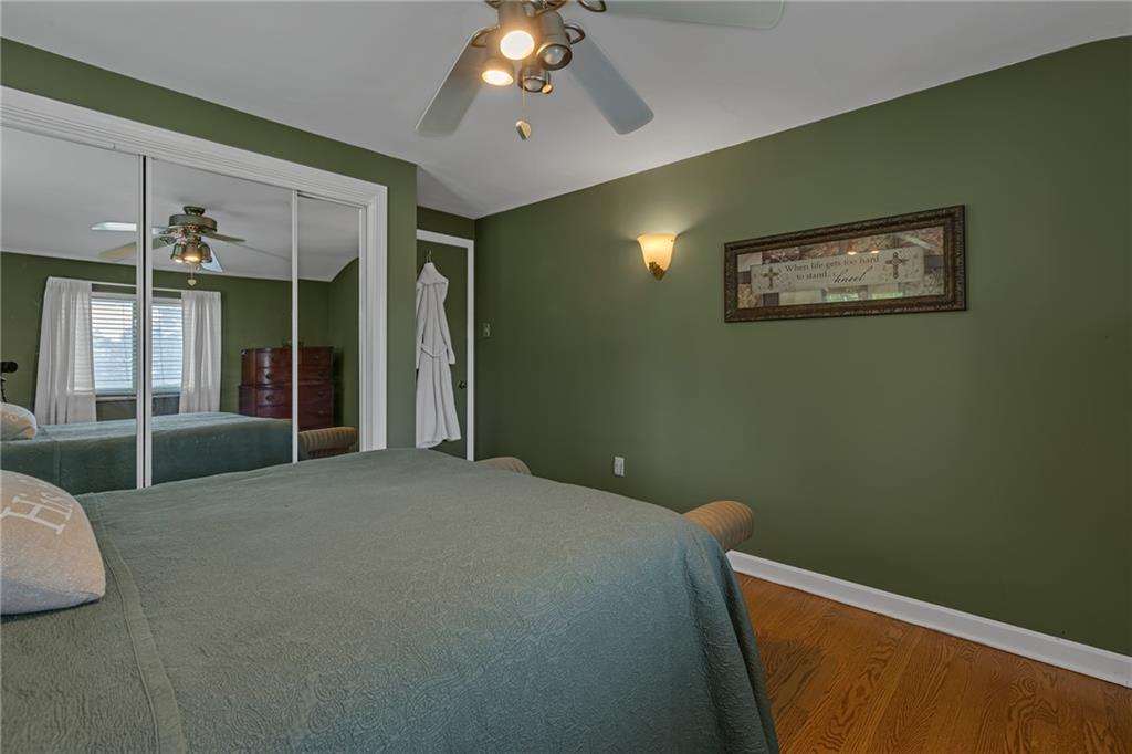 4830 Dutch Ridge Road Beaver, PA 15009 - Photo 25 of 42 a bedroom with a bed and a chandelier