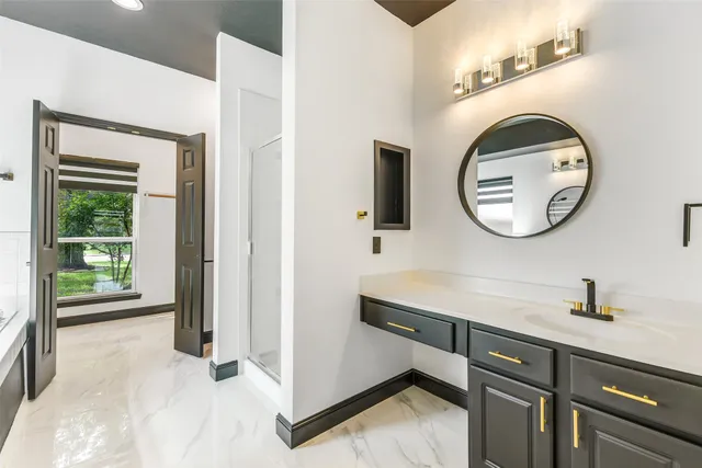 a bathroom with a sink and a mirror