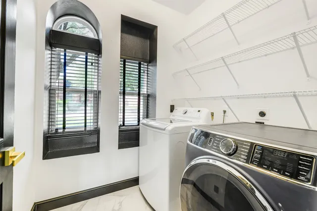 a bathroom with a toilet a sink and a mirror