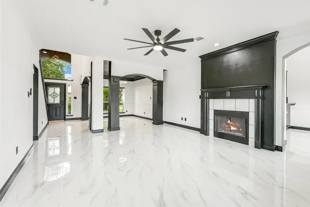 a view of a livingroom with a flat screen tv with a fireplace