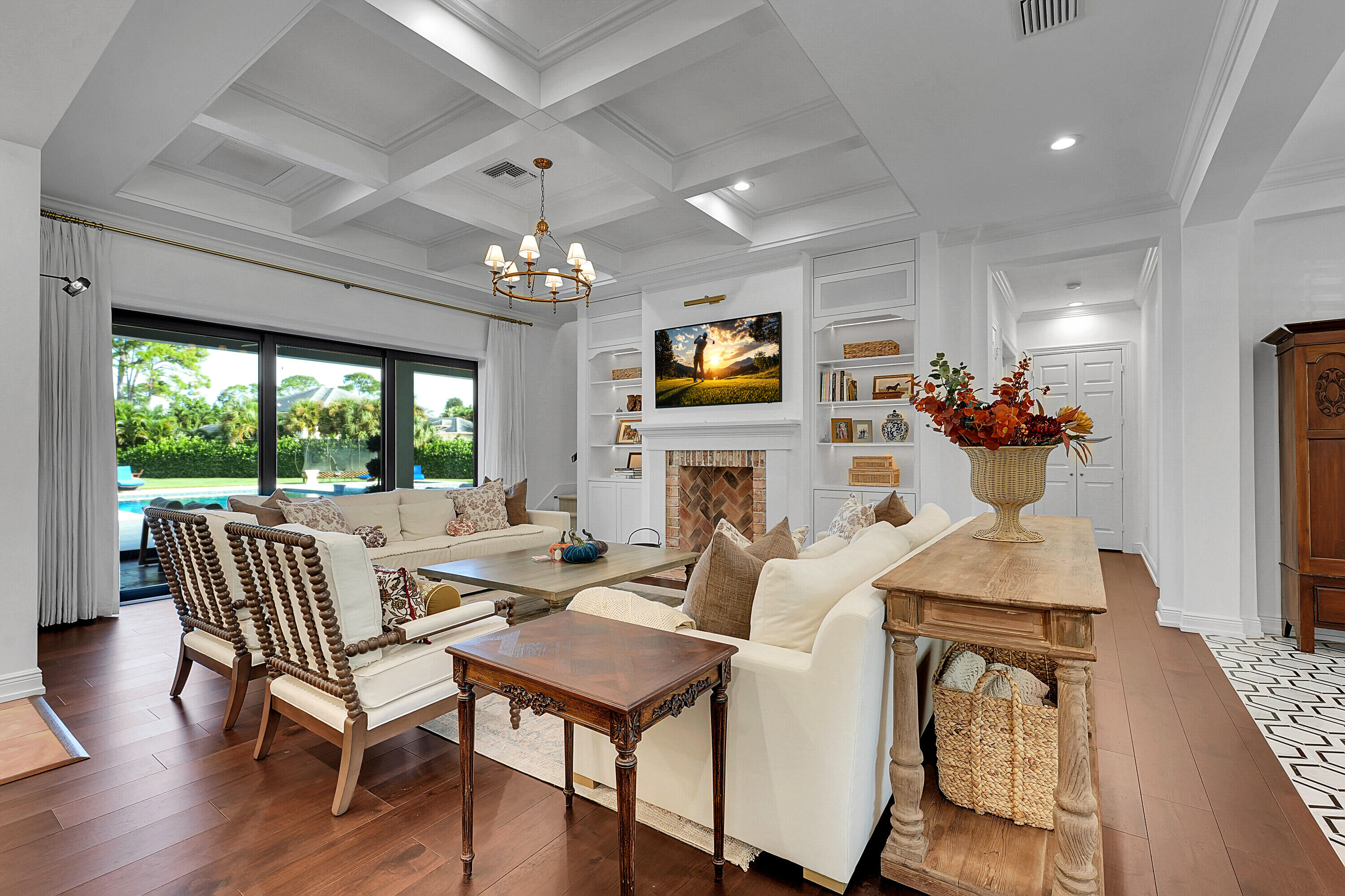 7660 Bold Lad Road Palm Beach Gardens, FL 33418 - Photo 18 of 68 a living room with fireplace furniture and a large window