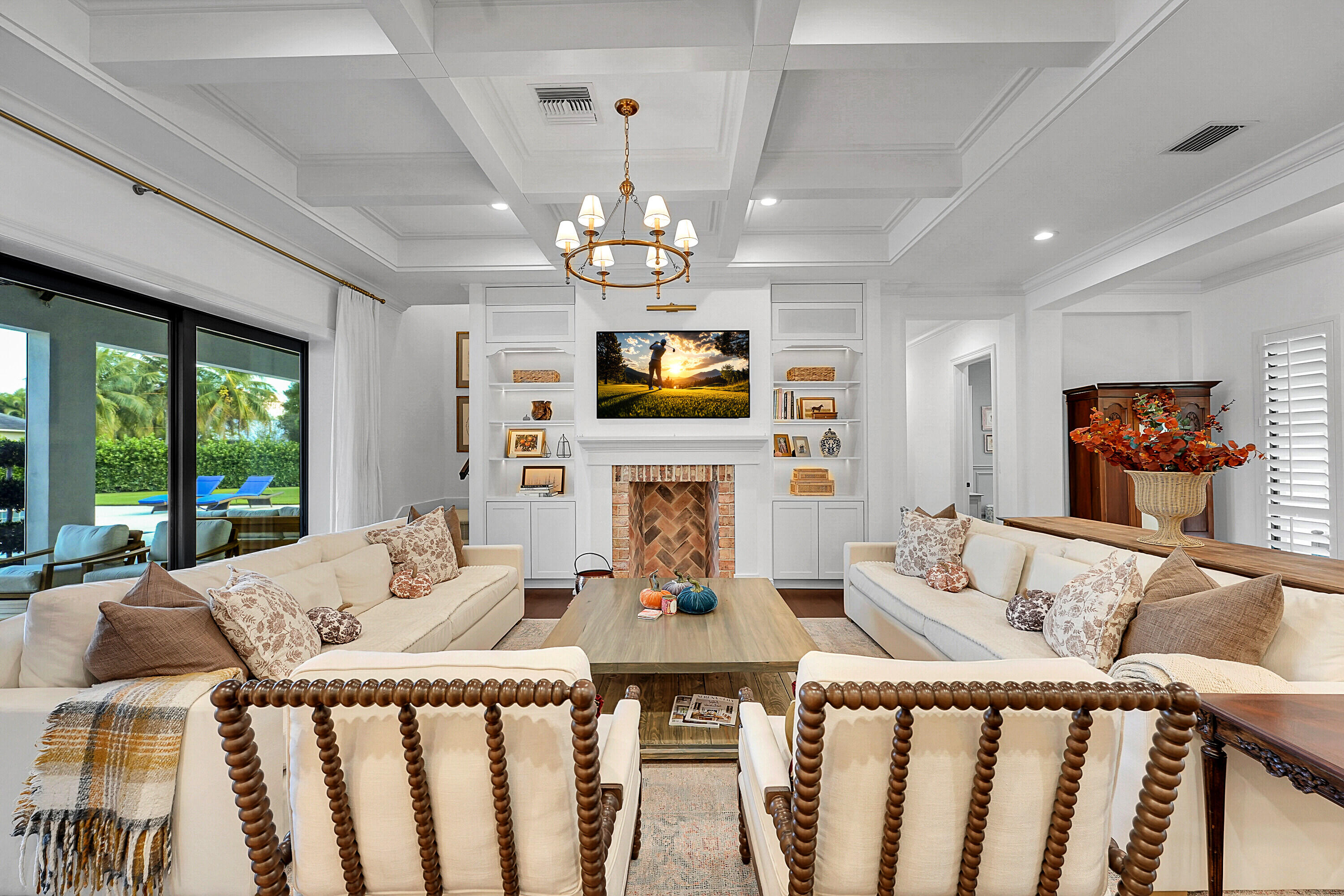 7660 Bold Lad Road Palm Beach Gardens, FL 33418 - Photo 19 of 68 a view of a dining room with furniture a chandelier windows and wooden floor