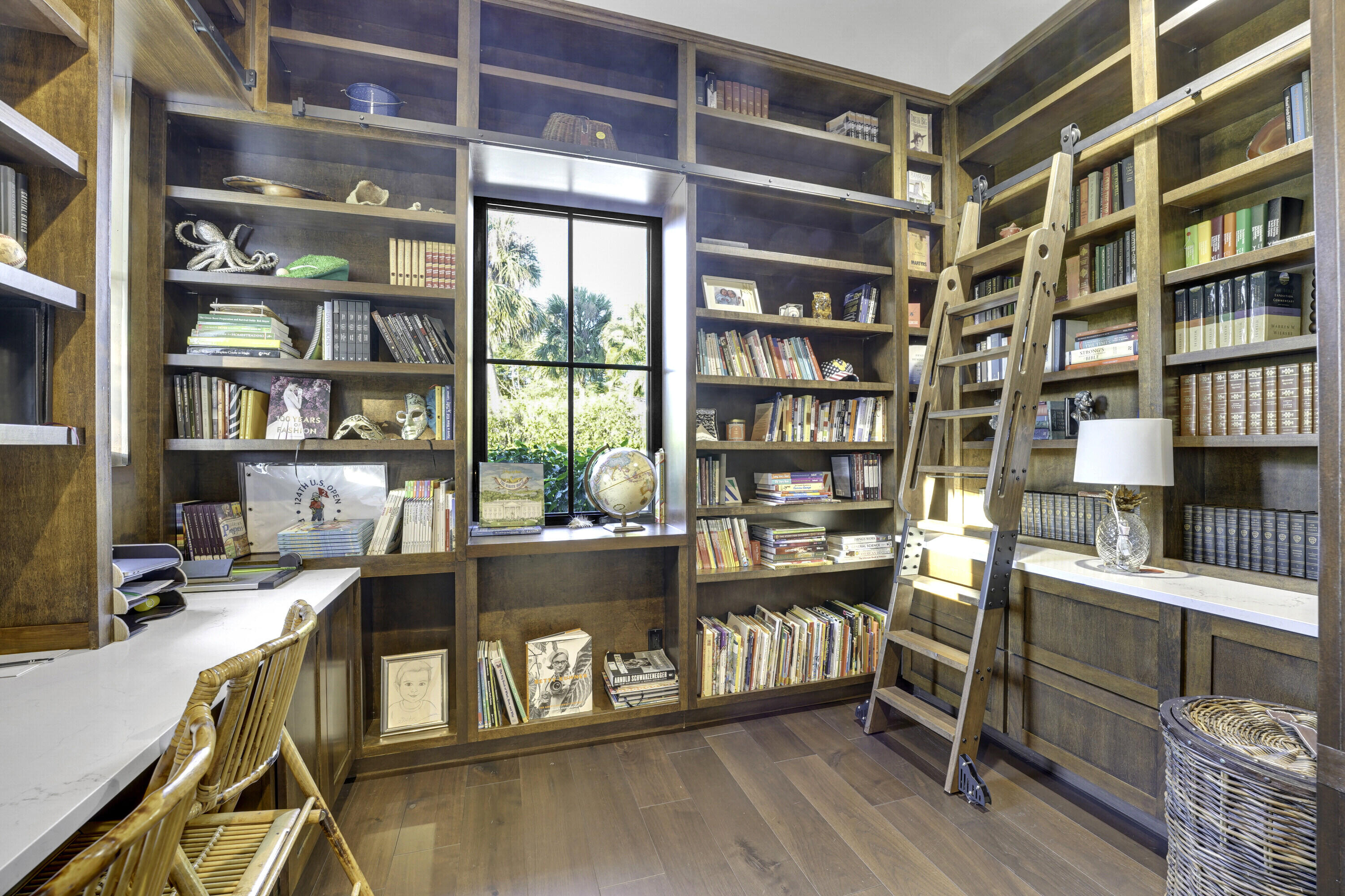 7660 Bold Lad Road Palm Beach Gardens, FL 33418 - Photo 21 of 68 a view of a workspace with furniture and a bookshelf