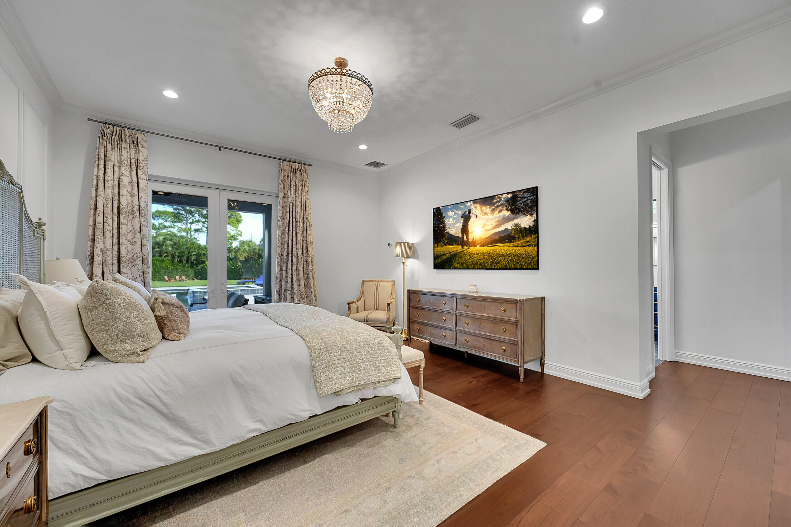 7660 Bold Lad Road Palm Beach Gardens, FL 33418 - Photo 25 of 68 a bedroom with a bed and a flat screen tv