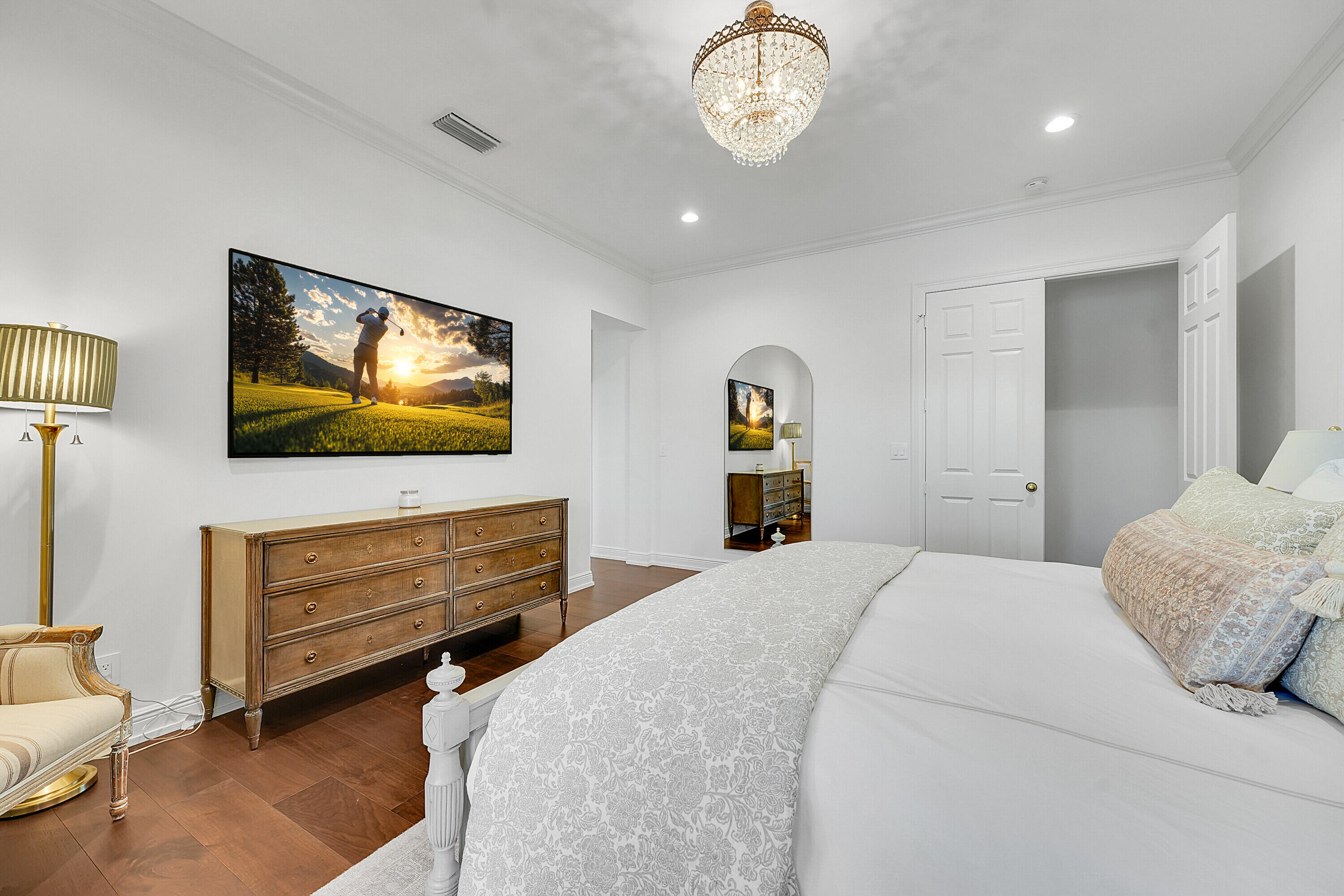 7660 Bold Lad Road Palm Beach Gardens, FL 33418 - Photo 28 of 68 a bedroom with a bed and a flat screen tv