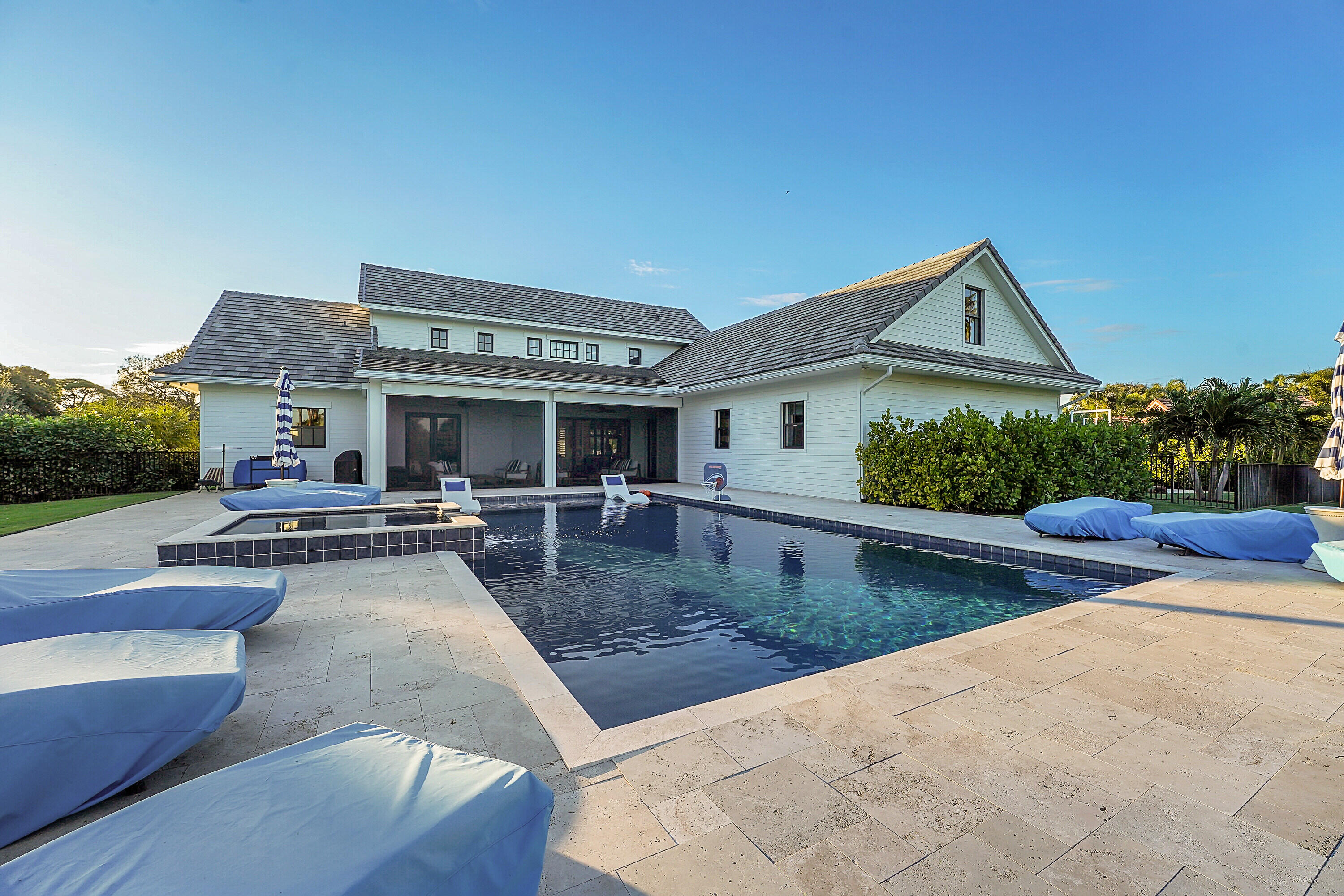 7660 Bold Lad Road Palm Beach Gardens, FL 33418 - Photo 3 of 68 a view of a house with swimming pool and sitting area