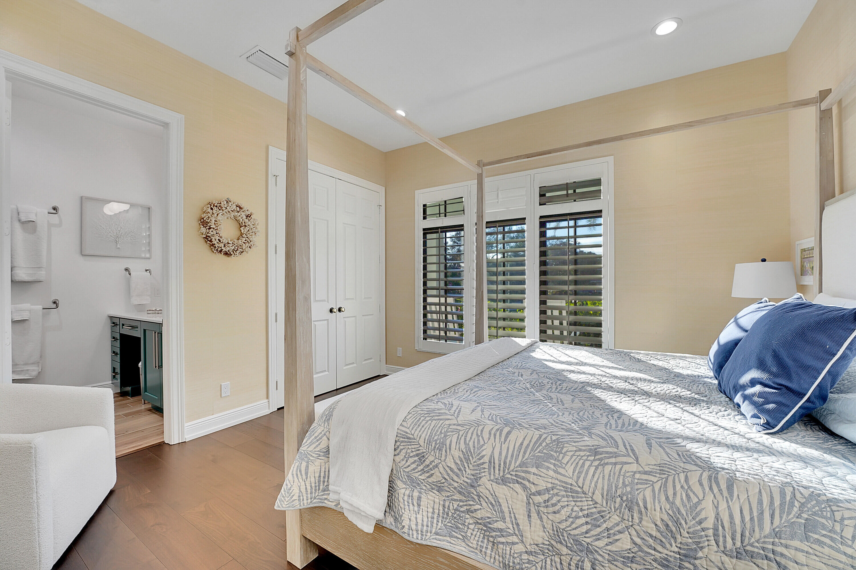 7660 Bold Lad Road Palm Beach Gardens, FL 33418 - Photo 32 of 68 a bedroom with a large bed and a window
