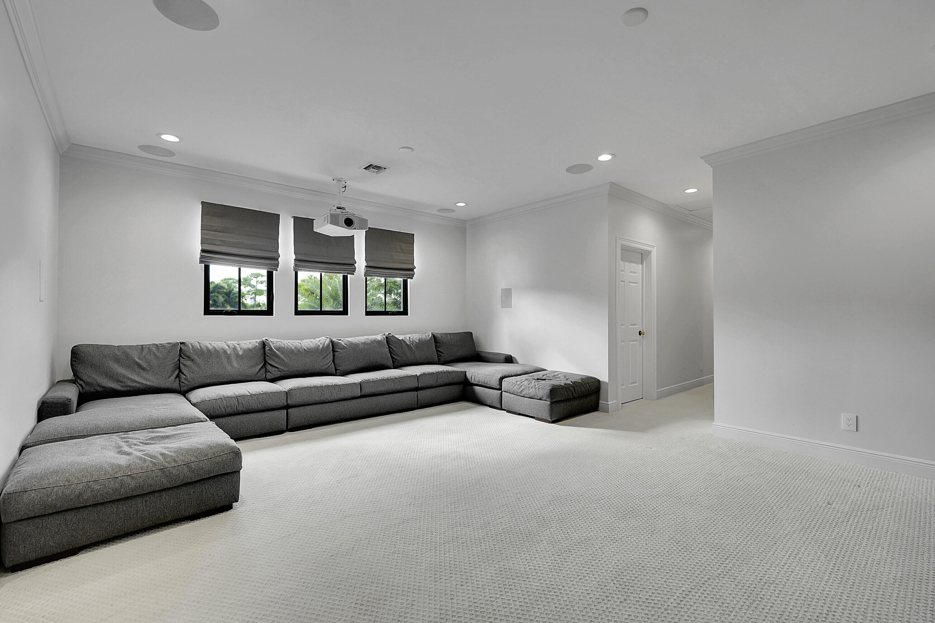 7660 Bold Lad Road Palm Beach Gardens, FL 33418 - Photo 42 of 68 a living room with furniture and a large window