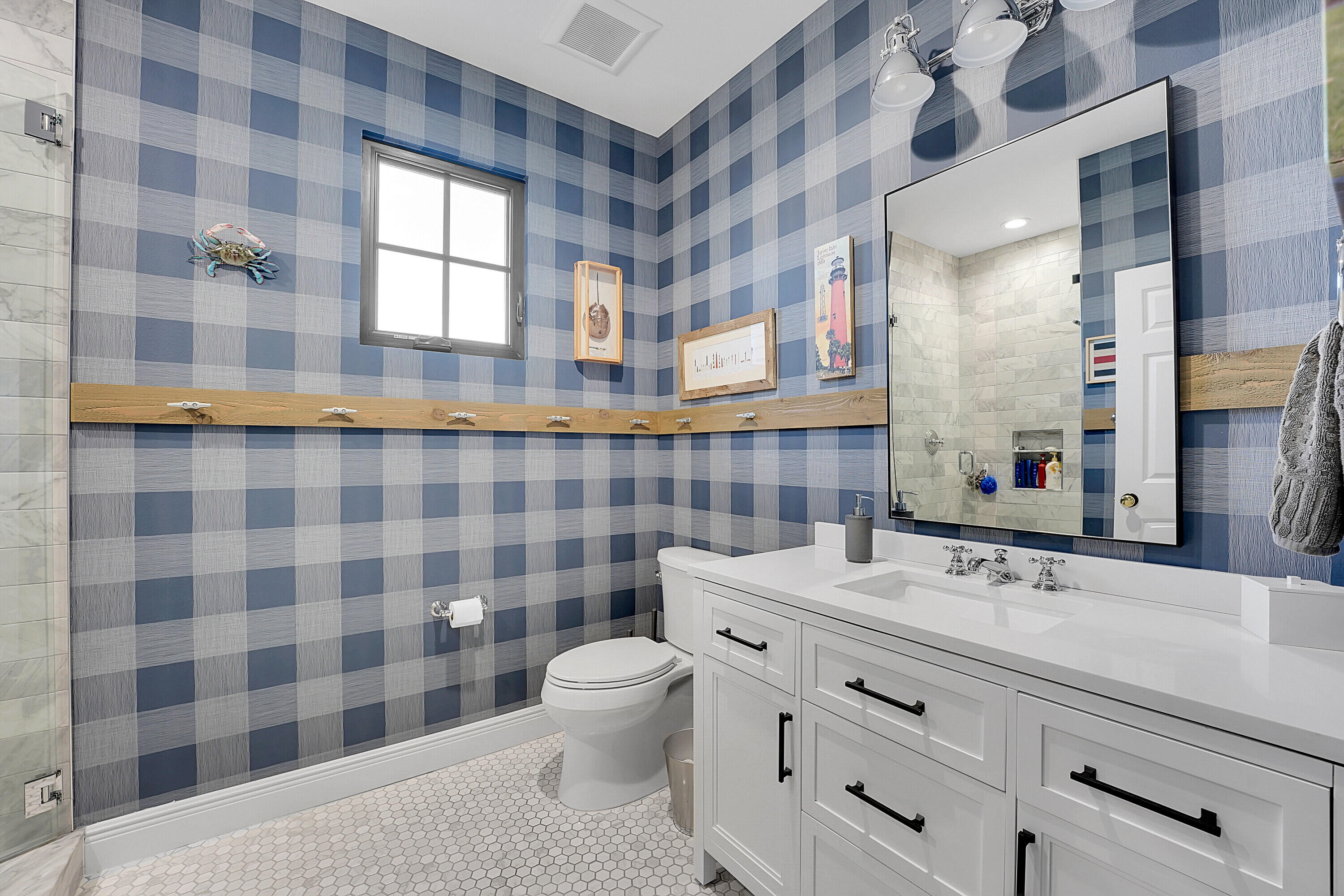 7660 Bold Lad Road Palm Beach Gardens, FL 33418 - Photo 47 of 68 a bathroom with a sink a toilet a mirror and shower