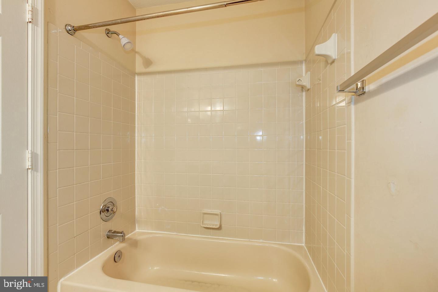 2106 Whitehall Road, Unit 2D Frederick, MD 21702 - Photo 32 of 33 a bathroom with a shower and a bath tub