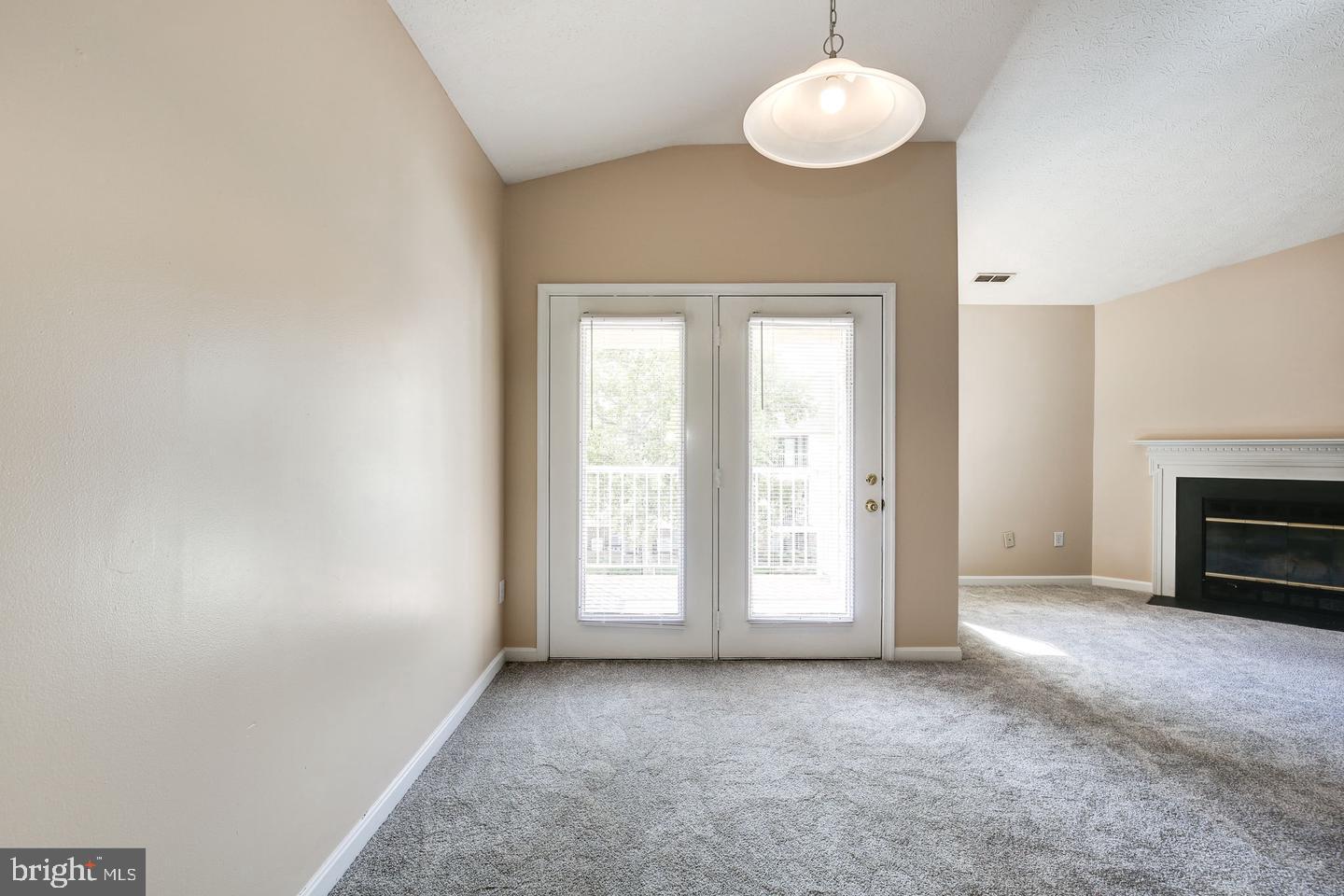 2106 Whitehall Road, Unit 2D Frederick, MD 21702 - Photo 10 of 33 an empty room with windows and fan