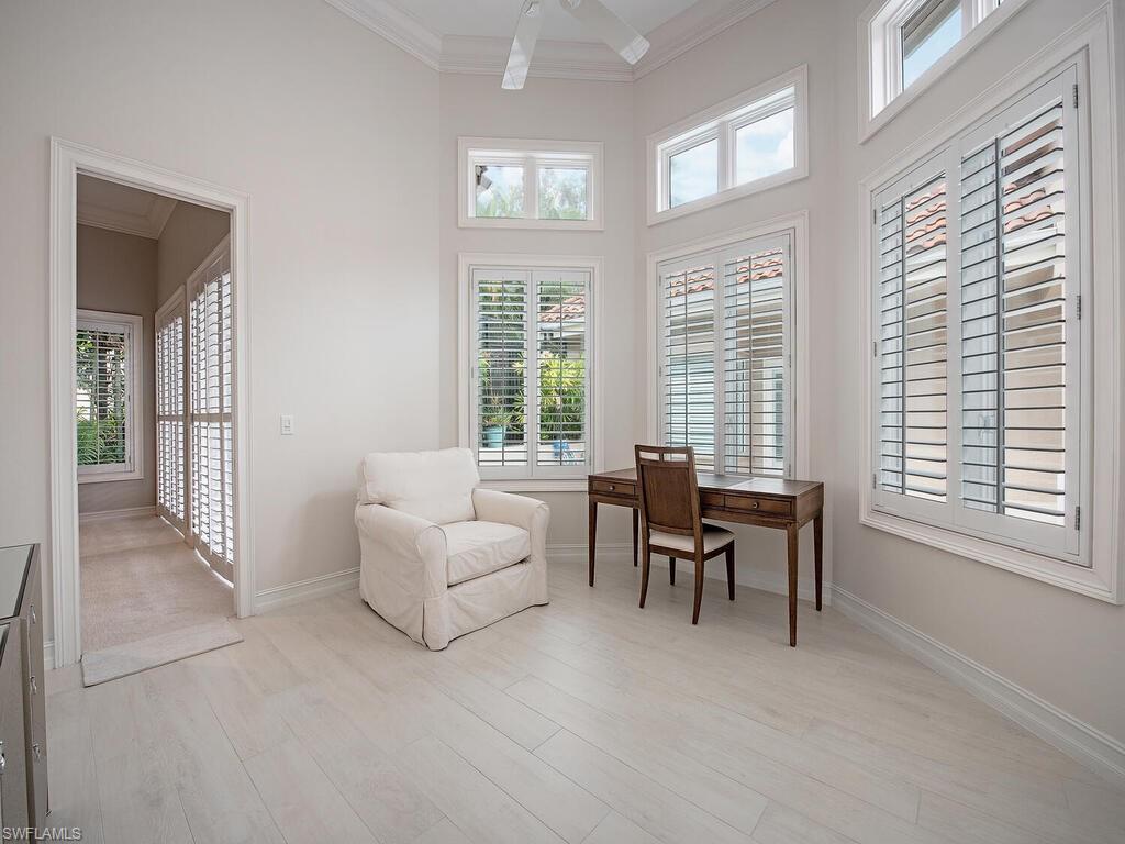 2080 Gordon Drive Naples, FL 34102 - Photo 23 of 25 a living room with furniture and large windows