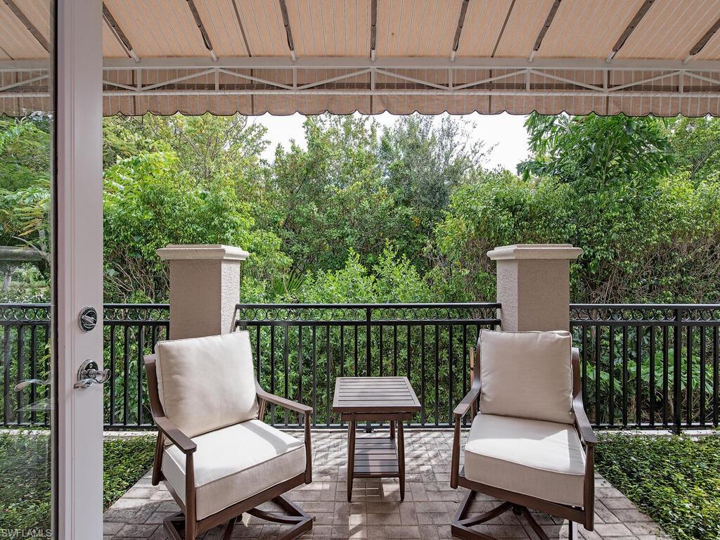 2080 Gordon Drive Naples, FL 34102 - Photo 5 of 25 a view of a chair and table in the balcony