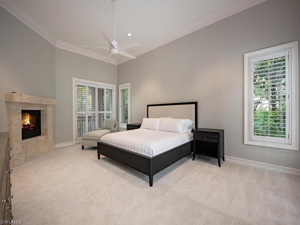2080 Gordon Drive Naples, FL 34102 - Photo 10 of 25 a spacious bedroom with a bed and a window