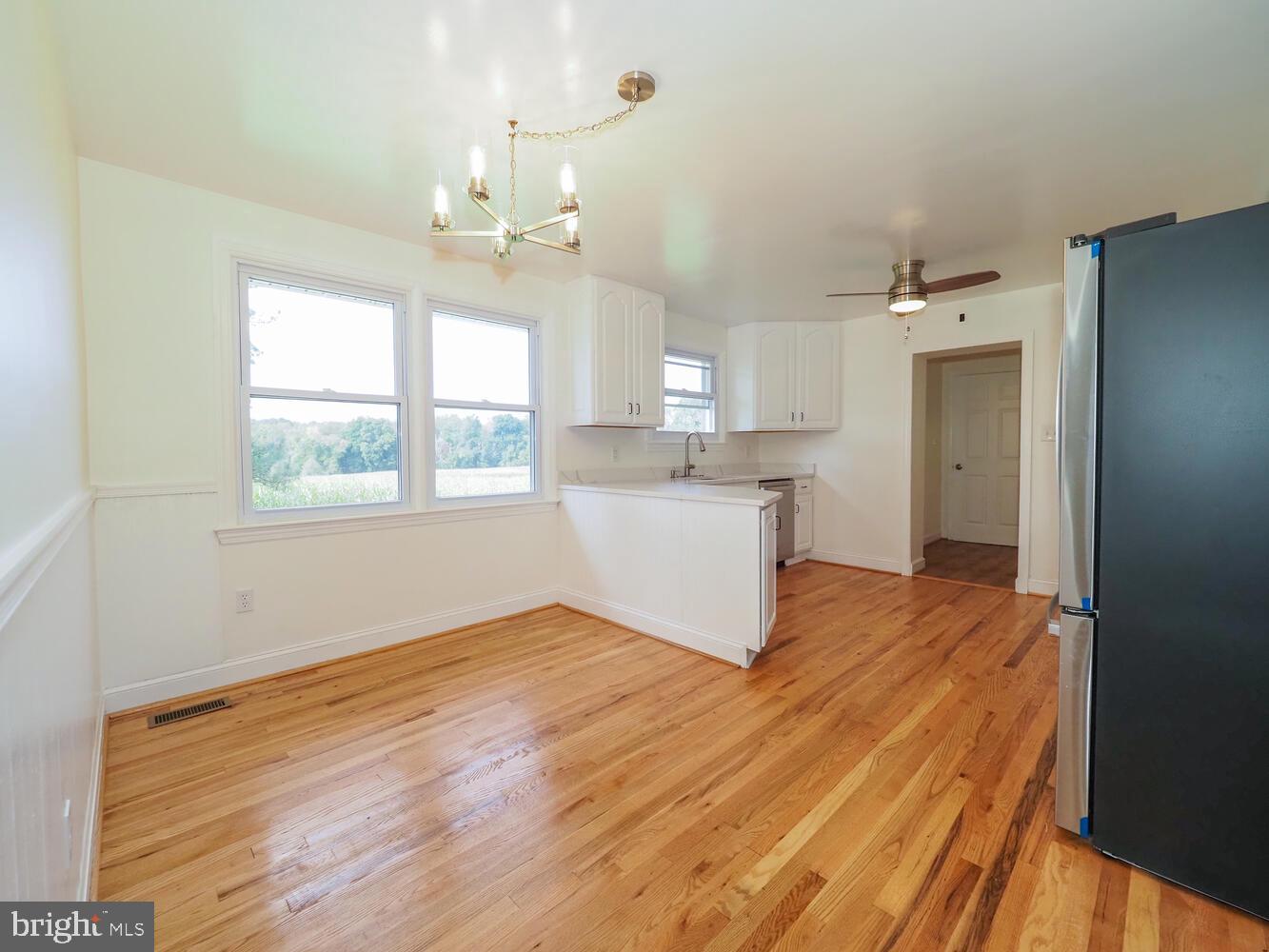 418 Hiobs Lane Aberdeen, MD 21001 - Photo 17 of 46 a view of a kitchen with wooden floor and a window