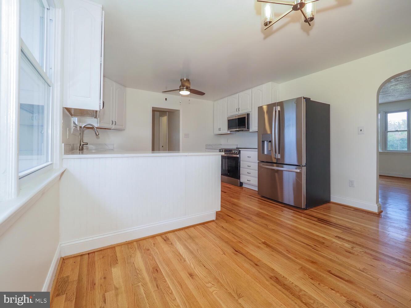 418 Hiobs Lane Aberdeen, MD 21001 - Photo 18 of 46 a kitchen with stainless steel appliances a refrigerator and a stove top oven