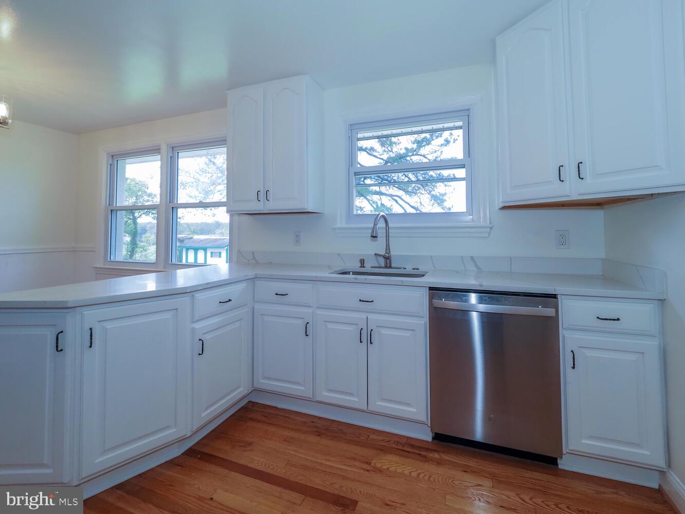 418 Hiobs Lane Aberdeen, MD 21001 - Photo 19 of 46 a kitchen with granite countertop white cabinets window and sink
