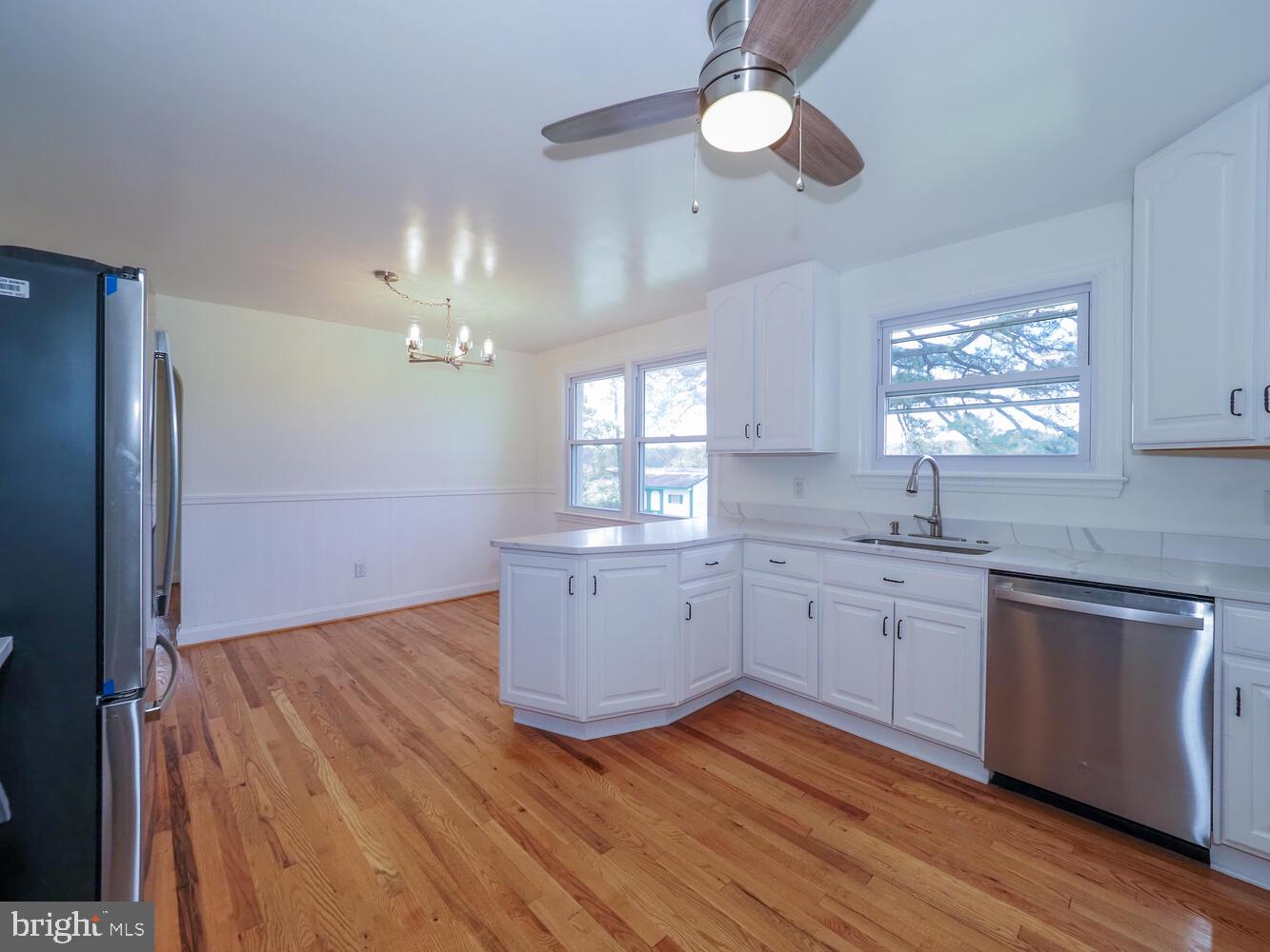 418 Hiobs Lane Aberdeen, MD 21001 - Photo 23 of 46 a kitchen with sink cabinets and wooden floor