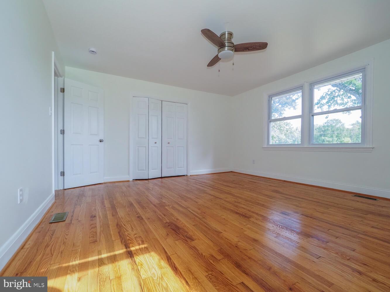 418 Hiobs Lane Aberdeen, MD 21001 - Photo 31 of 46 a view of empty room with wooden floor and fan