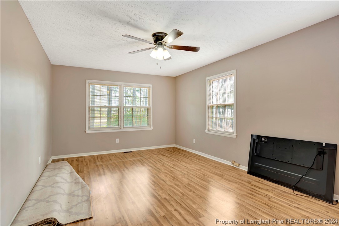 527 Old Allenton Road Lumberton, NC 28358 - Photo 13 of 20 a view of an empty room with wooden floor and a window