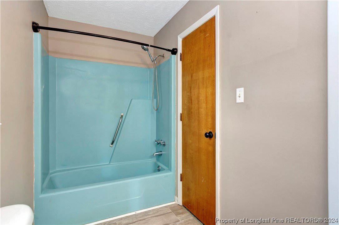527 Old Allenton Road Lumberton, NC 28358 - Photo 15 of 20 a bathroom with a shower and a bath tub