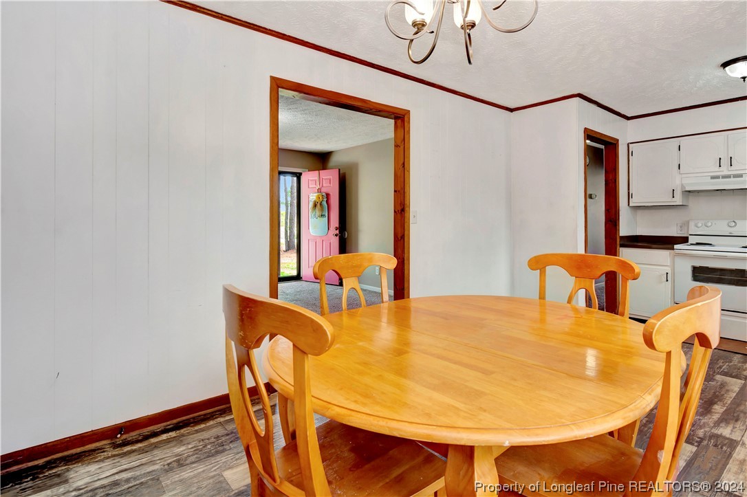 527 Old Allenton Road Lumberton, NC 28358 - Photo 9 of 20 a dining room with furniture and wooden floor