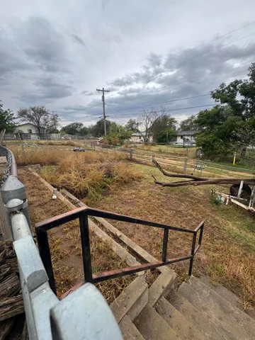 a house view with a sitting space and garden space