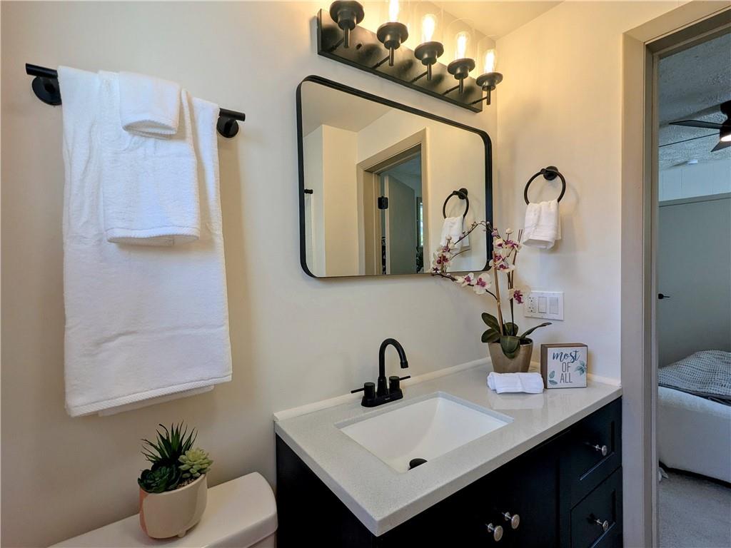 310 East Penn Street Butler, PA 16001 - Photo 15 of 30 a bathroom with a sink vanity and a mirror