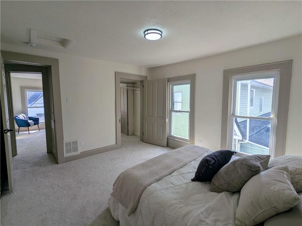 310 East Penn Street Butler, PA 16001 - Photo 20 of 30 a bedroom with a bed and a large mirror
