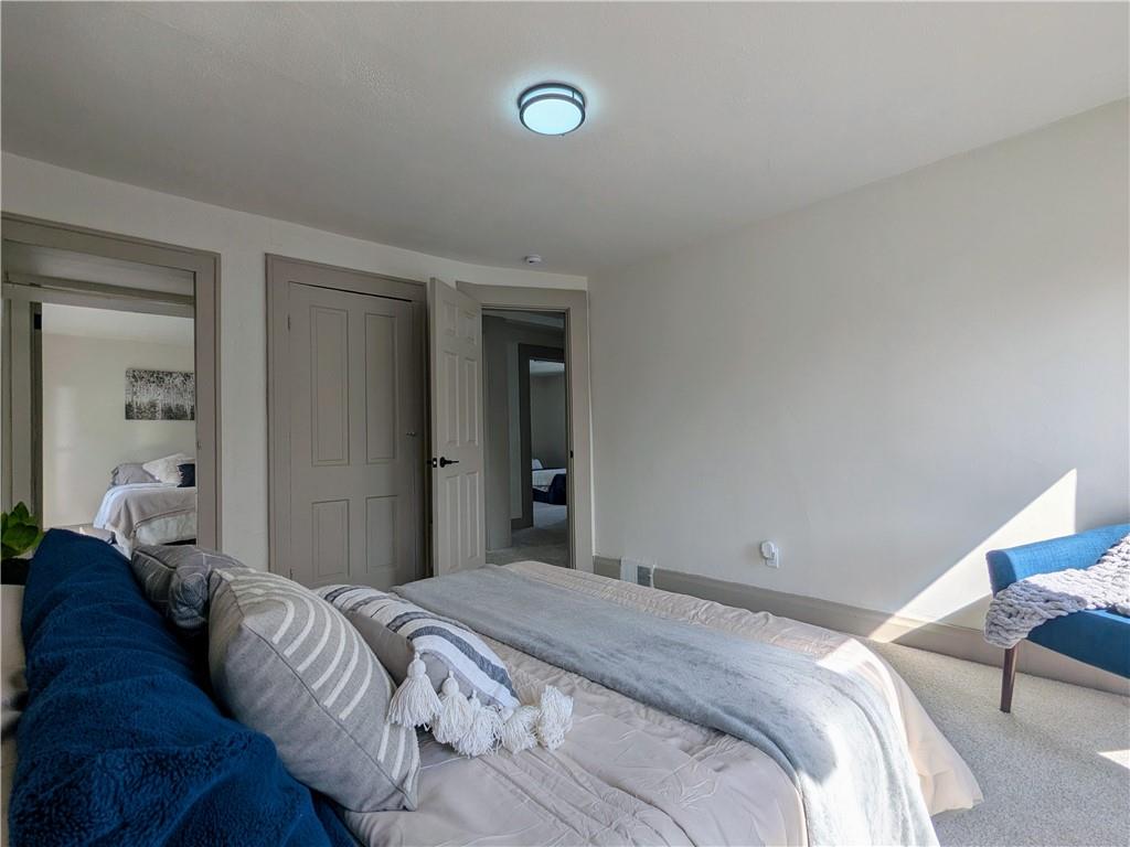 310 East Penn Street Butler, PA 16001 - Photo 21 of 30 a bedroom with a bed and with a mirror