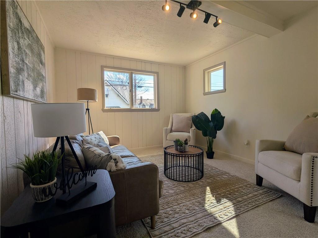 310 East Penn Street Butler, PA 16001 - Photo 3 of 30 a living room with furniture and a potted plant
