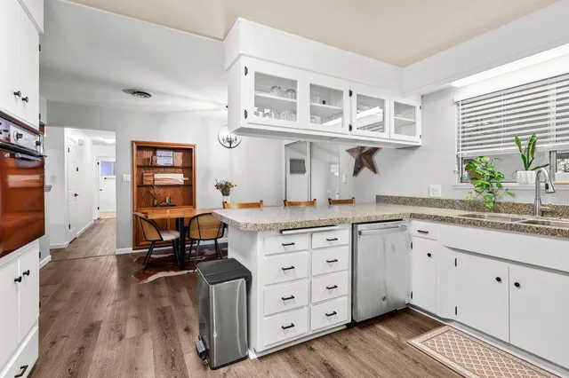 a view of a dining room with furniture and window