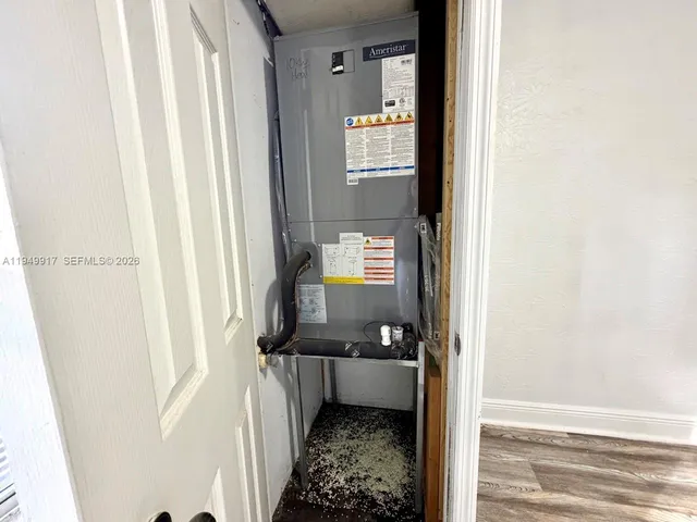 wooden floor with a bathroom