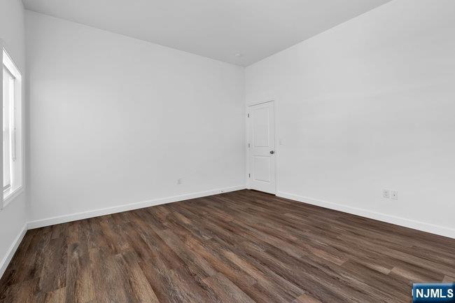 2 Rossi Court, Unit 2 South Hackensack, NJ 07606 - Photo 16 of 20 a view of an empty room with wooden floor