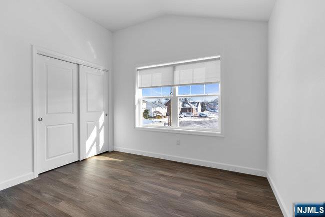 2 Rossi Court, Unit 2 South Hackensack, NJ 07606 - Photo 19 of 20 an empty room with wooden floor and windows