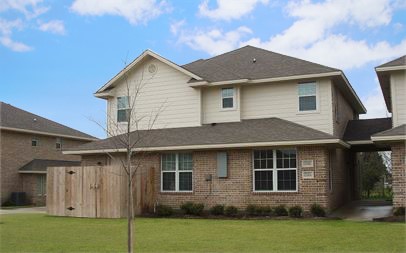 2328 Autumn Chase Loop, Unit B College Station, TX 77840 - Photo 1 of 1 a front view of a house with garden